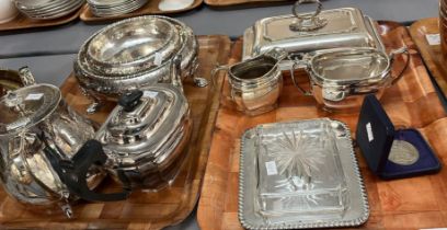 Two trays of silver plate to include: teapots, milk jug, sugar bowl, City of Belfast coin in case,