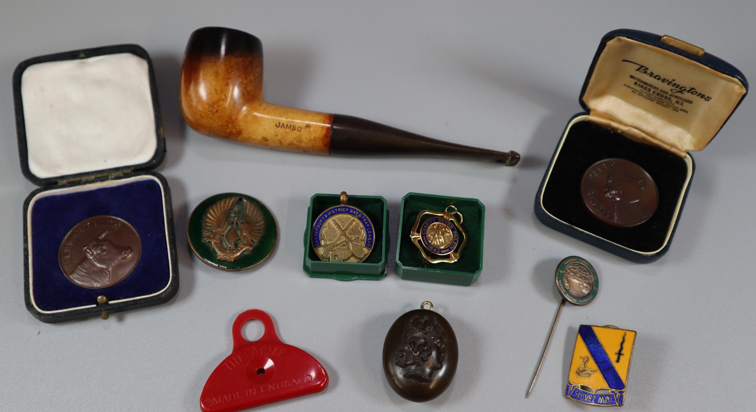Plastic tub comprising Whitby Jet carved locket, ACME Shepherds Lip Whistle, Milk Drink for Health