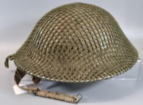 WWII British helmet dated 1939, owned by 569987 Sgt Clarke. (B.P. 21% + VAT)