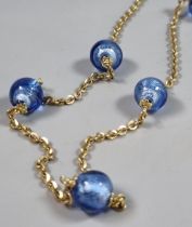 9ct gold chain with blue glass beads. 13.3g approx. (B.P. 21% + VAT)