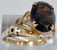 Two 9ct gold dress rings, one missing a stone the other with probably smokey quartz stone. 4.2g