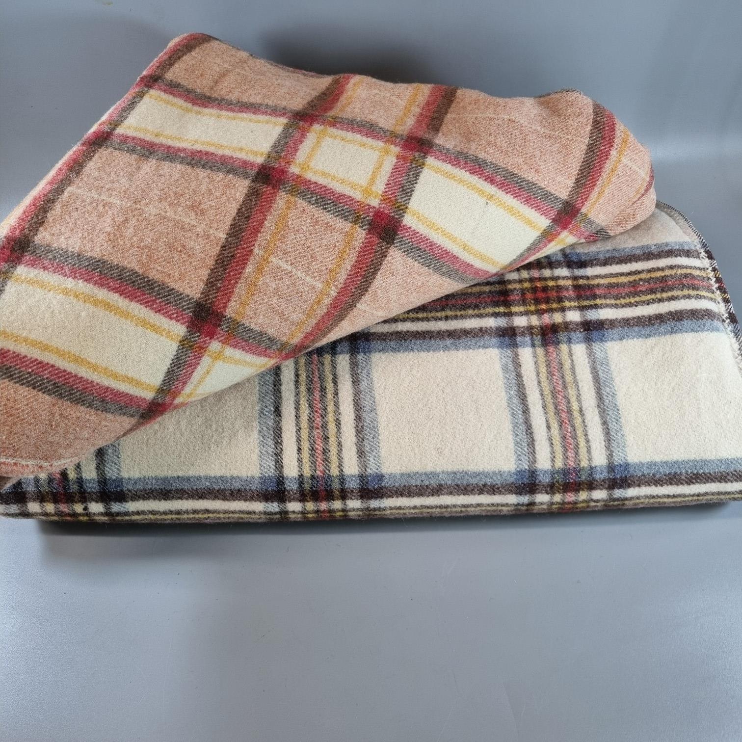 Two multi-coloured Welsh checked blankets. (2) (B.P. 21% + VAT)