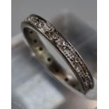 White gold or platinum diamond full eternity ring. Unmarked. 2.21g approx. Size J1/2. (B.P. 21% +