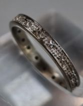White gold or platinum diamond full eternity ring. Unmarked. 2.21g approx. Size J1/2. (B.P. 21% +