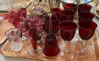 Collection of ruby and cranberry glass items to include: wine glasses, brandy goblets, bell, pair of