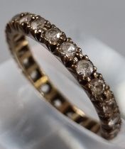 9ct gold full eternity style ring with white paste stones. 1.8g approx. Size M1/2. (B.P. 21% + VAT)