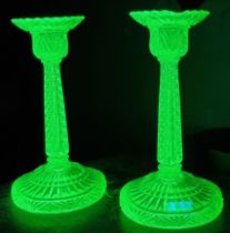 Pair of uranium glass moulded candlesticks together with a blue glass mallet shaped decanter and