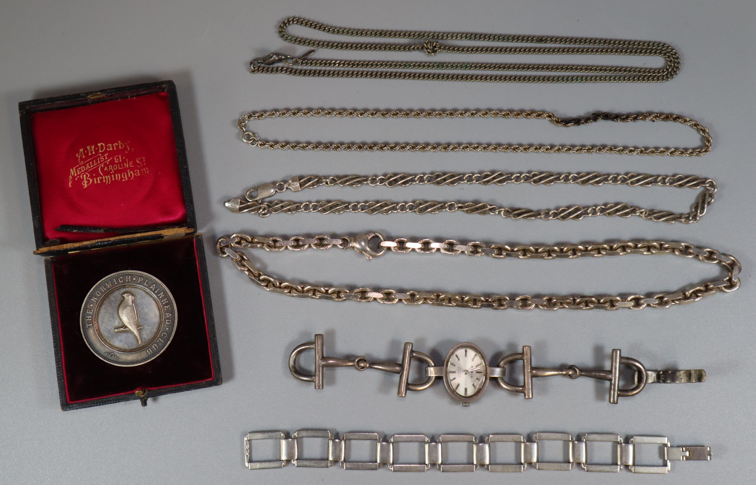 Collection of silver items to include: Karim ladies watch, chains, bracelets, The Norwich