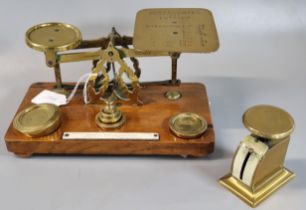 Victorian brass postal scales on an oak base by Windle & Blyth. (B.P. 21% + VAT)