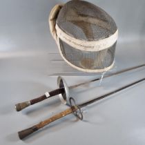 Vintage fencing mask, together with two fencing foils. (3) (B.P. 21% + VAT)