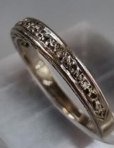 18ct white gold diamond half eternity ring. 3g approx. Size L. (B.P. 21% + VAT)
