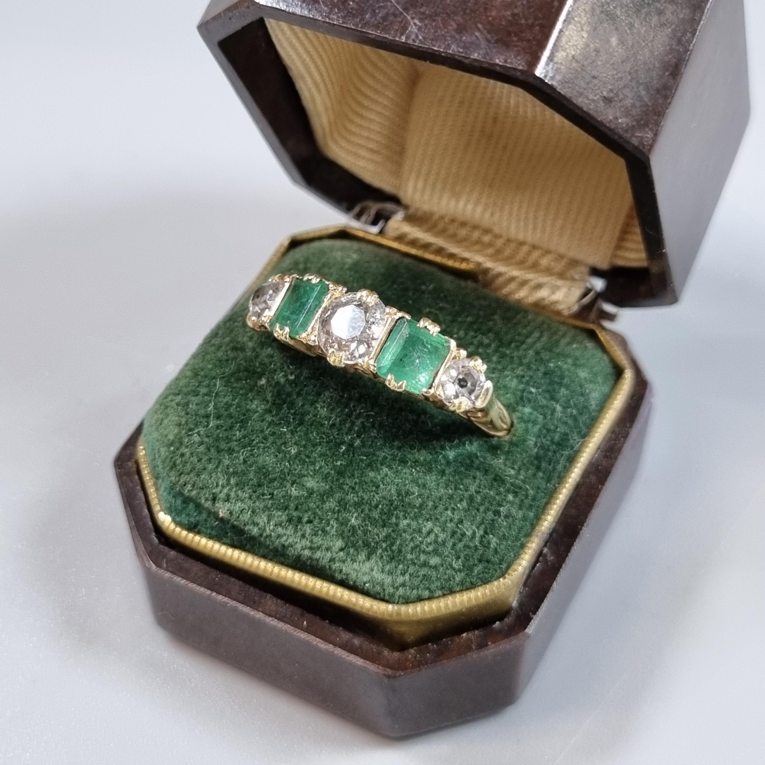 Probably 18ct gold diamond and emerald five stone ring, set with old cut diamonds, the centre