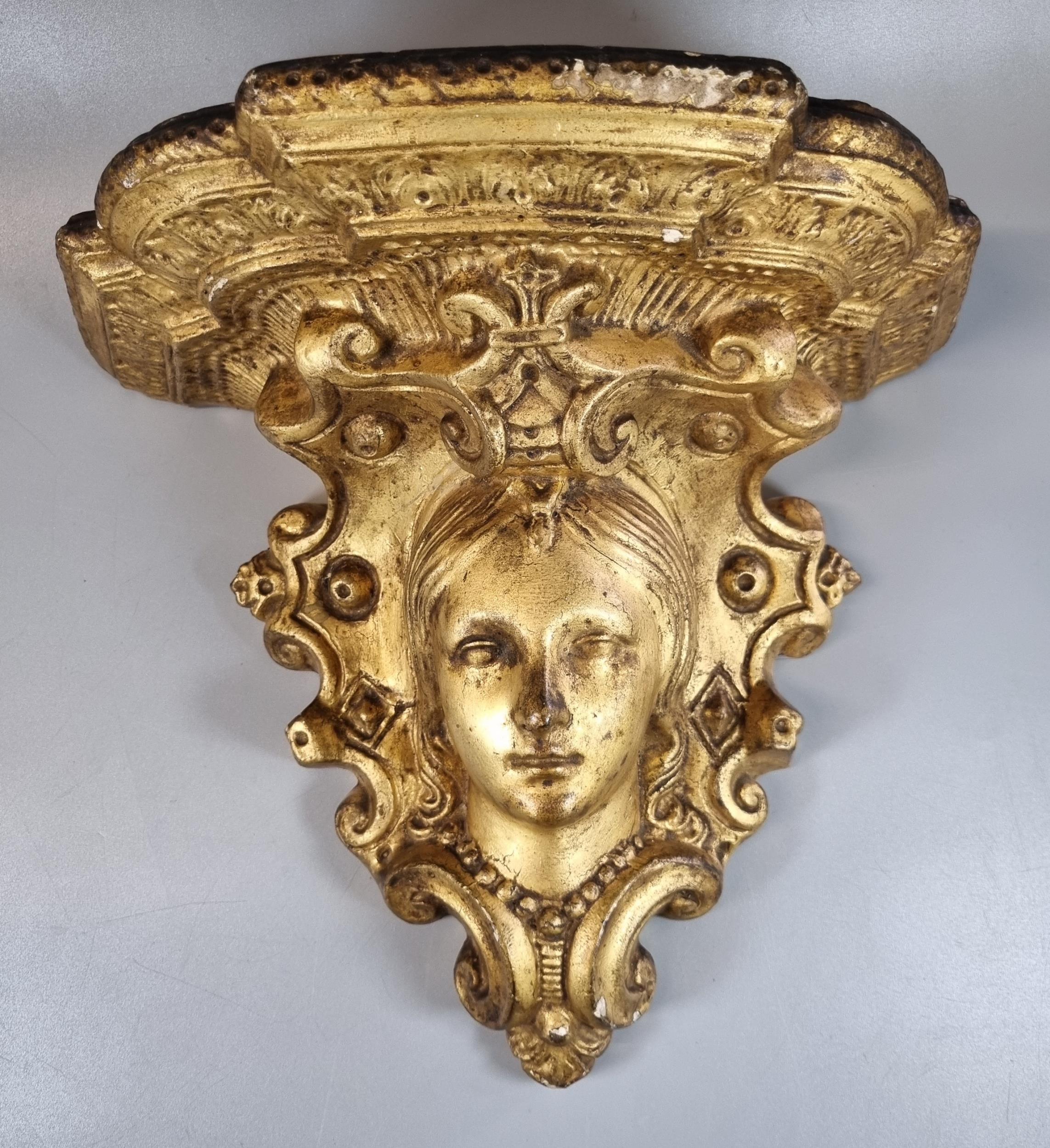 Decorative gilt wall bracket with mask head and moulded scroll decoration. (B.P. 21% + VAT)