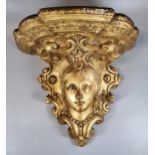 Decorative gilt wall bracket with mask head and moulded scroll decoration. (B.P. 21% + VAT)