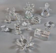 Collection of Swarovski crystal items to include: animals, insects, flowers, figurine of a young