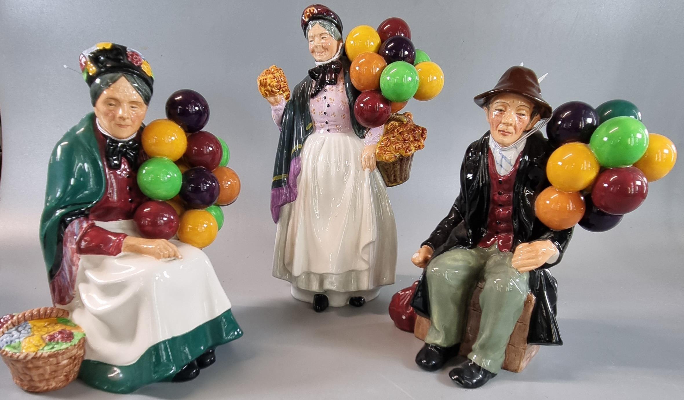 Three Royal Doulton bone china figurines to include: 'The Balloon Man', 'Biddy Pennyfarthing' and '