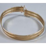 9ct gold bangle. 6.8g approx. (B.P. 21% + VAT)