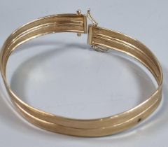 9ct gold bangle. 6.8g approx. (B.P. 21% + VAT)