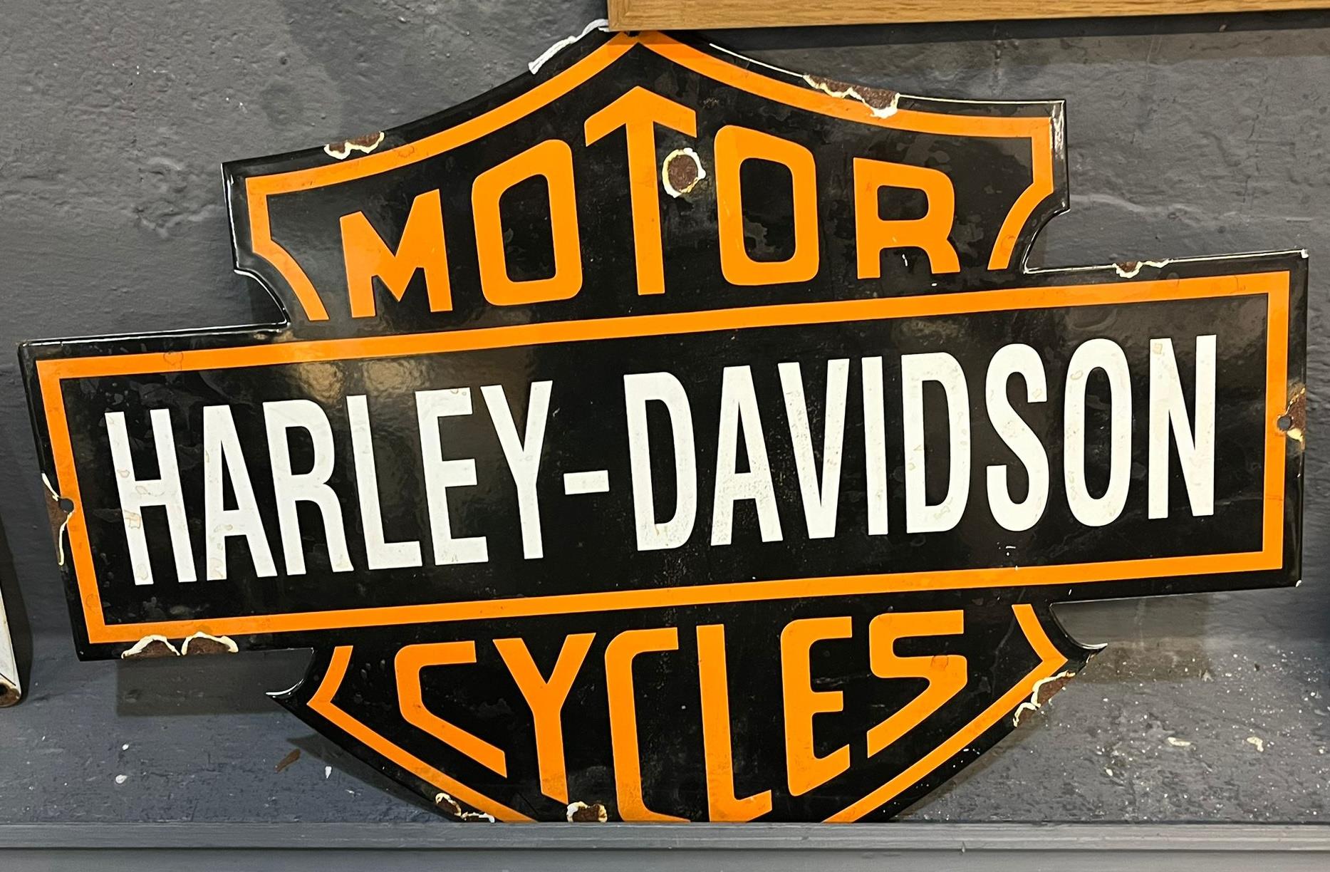 Enamelled metal advertising sign 'Harley-Davidson Motorcycles'. 50x32cm approx. (B.P. 21% + VAT)