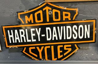 Enamelled metal advertising sign 'Harley-Davidson Motorcycles'. 50x32cm approx. (B.P. 21% + VAT)