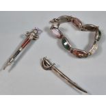 Scottish hardstone dirk kilt pin, cutlass sword brooch and hardstone bracelet. (3) (B.P. 21% + VAT)