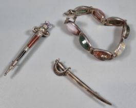 Scottish hardstone dirk kilt pin, cutlass sword brooch and hardstone bracelet. (3) (B.P. 21% + VAT)