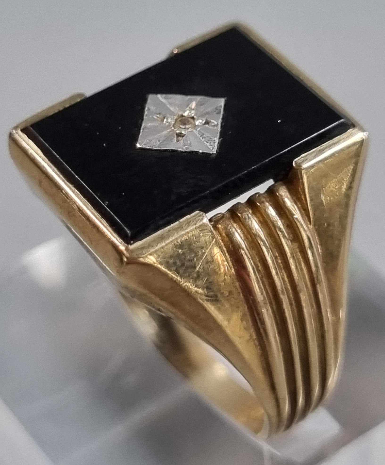 9ct gold black onyx signet ring with tiny diamond chip. 5.4g approx. Size S. (B.P. 21% + VAT)
