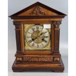 Early 20th century carved architectural design two train mantle clock with silver chapter ring,