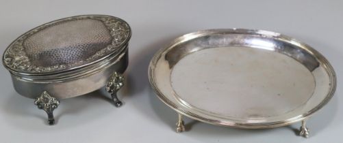 Late Victorian silver card tray standing on four paw feet by Goldmiths & Silversmiths Co London