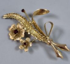 9ct gold floral and foliate brooch inset with rubies. 5.3g approx. (B.P. 21% + VAT)