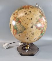Novelty table lamp in the form of a globe on hexagonal base. (B.P. 21% + VAT)