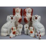 Collection of Staffordshire fireside seated spaniels of varying sizes. (9) (B.P. 21% + VAT)