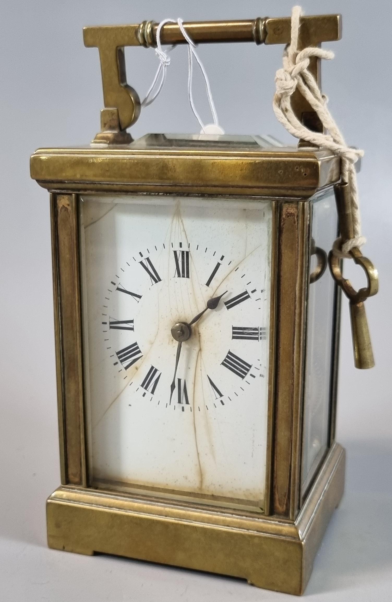 French brass carriage clock with full depth Roman ceramic face and two train movement striking on