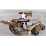 Three vintage cannons on wooden stands with metal and wooden wheels. (3) (B.P. 21% + VAT)