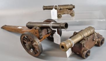 Three vintage cannons on wooden stands with metal and wooden wheels. (3) (B.P. 21% + VAT)