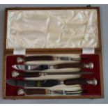 Early 20th century five piece cased carving set with horn handles, steel blades and silver collars/