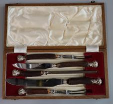 Early 20th century five piece cased carving set with horn handles, steel blades and silver collars/