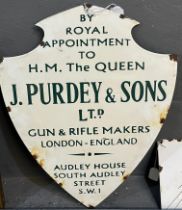 Enamelled metal shield shape sign 'By Royal Appointment to H M the Queen, J Purdey & Sons Ltd. Gun
