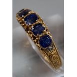 15ct gold Victorian ring set with five cornflower blue sapphires. 1.7g approx. Size L1/2. In antique