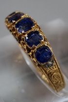 15ct gold Victorian ring set with five cornflower blue sapphires. 1.7g approx. Size L1/2. In antique