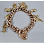 9ct gold curb link charm bracelet with assorted charms including: heart shaped padlock, harp,