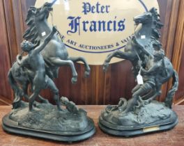 Pair of early 20th century French spelter Marley Horses with Grooms on naturalistic bases. 52cm high