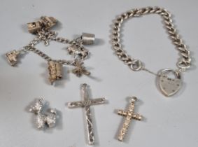 Collection of silver charm bracelets with charms together with a curb link bracelet and heart shaped