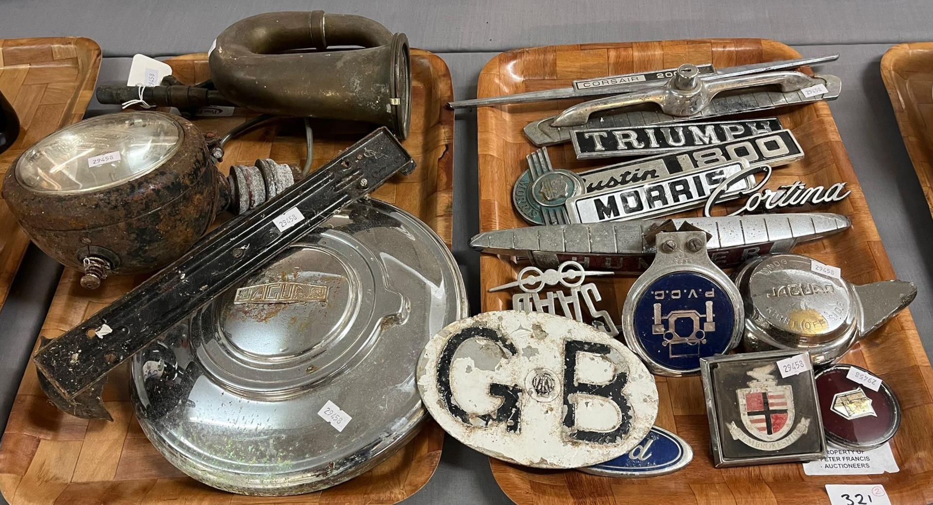Quantity of automobilia items to include: vehicle badges, bumper badges, Jaguar wheel spinner,