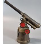 Well made brass working model of a single barrelled Naval gun on pedestal base. 12cm high approx. (