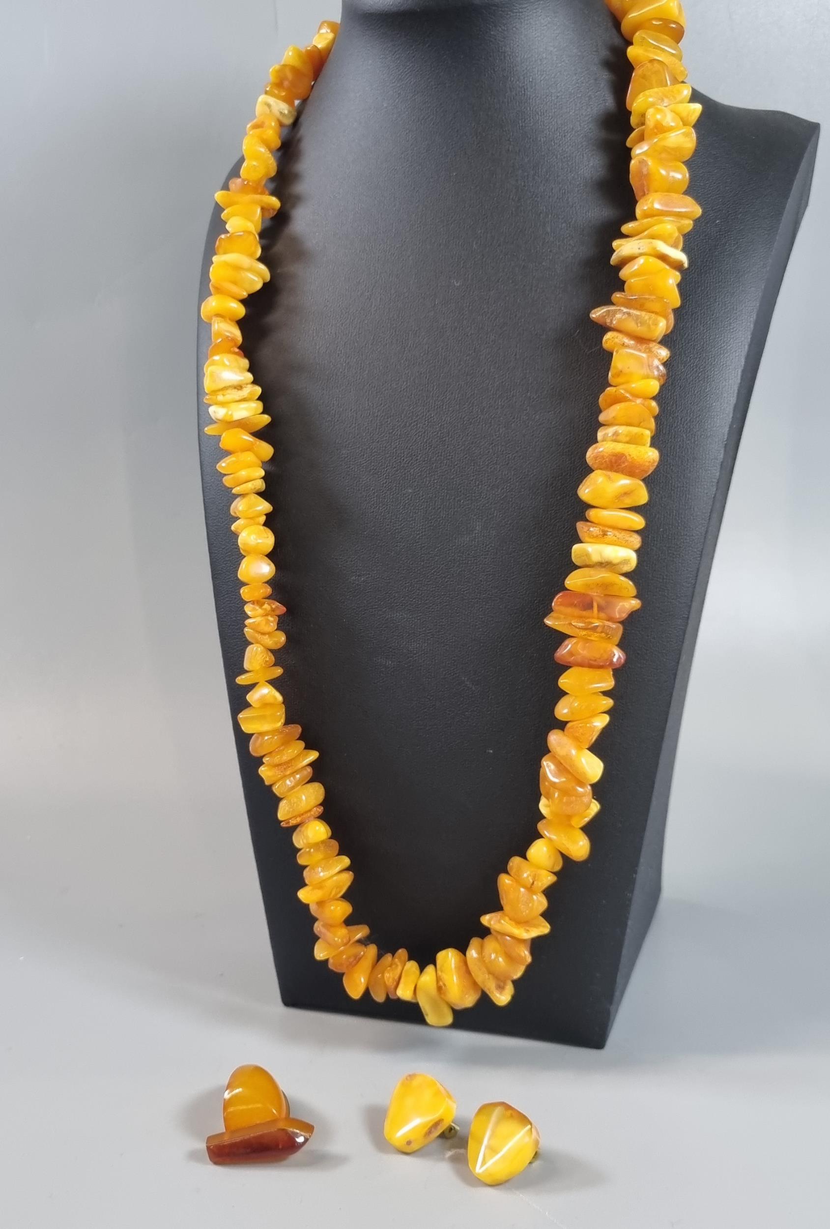 Amber butterscotch necklace (60g approx.) together with a pair of amber clip-on earrings and a - Image 2 of 2