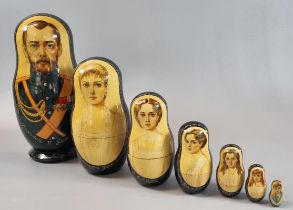Russian hand painted soft wood Babushka doll, decorated with images on Tzar Nicholas II, his wife