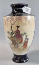 Japanese export earthenware Satsuma style vase with polychrome panels on a gilt blue ground. Three