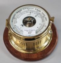 Modern Shatz brass bulkhead type 'compensation precision barometer' on wooden plaque. The face