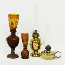 Four table oil lamps.